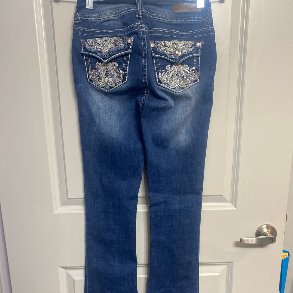 Three pairs of jeans all priced separately